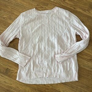 Woman’s pink sweater